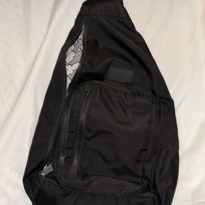 A black Very Bradley side bag in perfect condition.